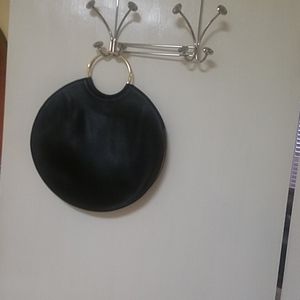 Black faux leather handbag.